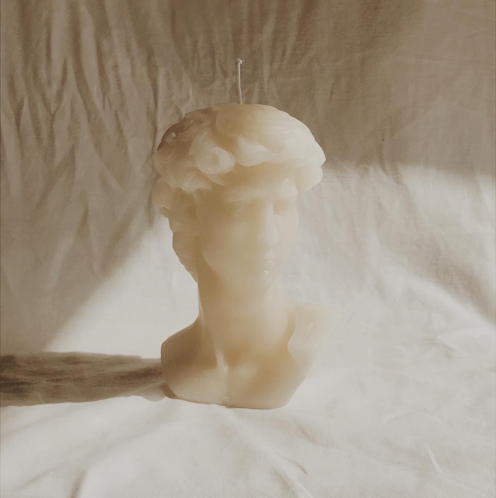 Prometheus Candle featuring a bust of Prometheus, symbolizing fire and civilization in a soft light.