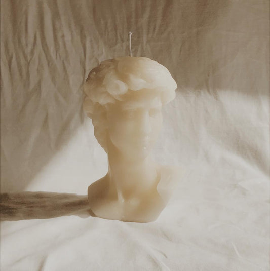 Prometheus Candle featuring a bust of Prometheus, symbolizing fire and civilization in a soft light.